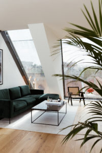 Vicky Heiler Apartment, Living Room: Green Velvet Sofa - Bikinis & Passports